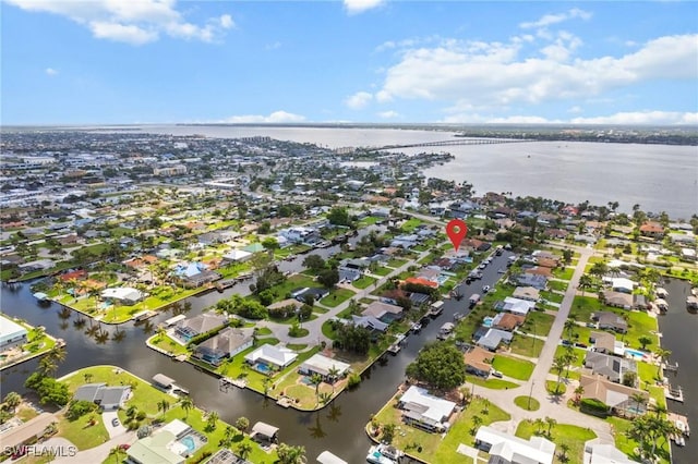 1442 Wellington Ct, Cape Coral, FL 33904 - aerial view of property's location with a large body of water and nearby suburban area