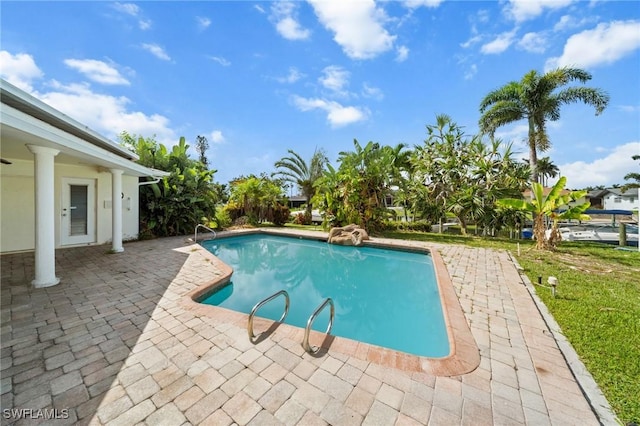 1442 Wellington Ct, Cape Coral, FL 33904 - outdoor pool with a patio area