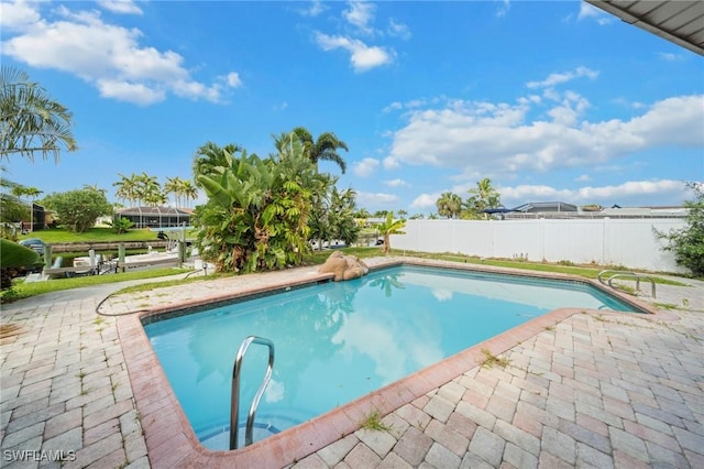 1442 Wellington Ct, Cape Coral, FL 33904 - view of swimming pool featuring a patio