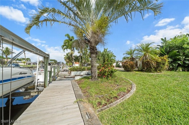 1442 Wellington Ct, Cape Coral, FL 33904 - dock with boat lift and a yard