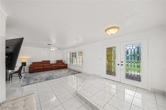 1442 Wellington Ct, Cape Coral, FL 33904 - living room with french doors, ceiling fan, and light marble finish flooring