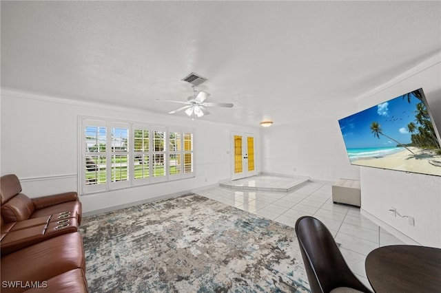 1442 Wellington Ct, Cape Coral, FL 33904 - tiled living area with ceiling fan and french doors