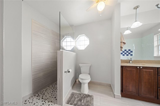 1442 Wellington Ct, Cape Coral, FL 33904 - full bath featuring vanity, a walk in shower, ceiling fan, and tile patterned flooring