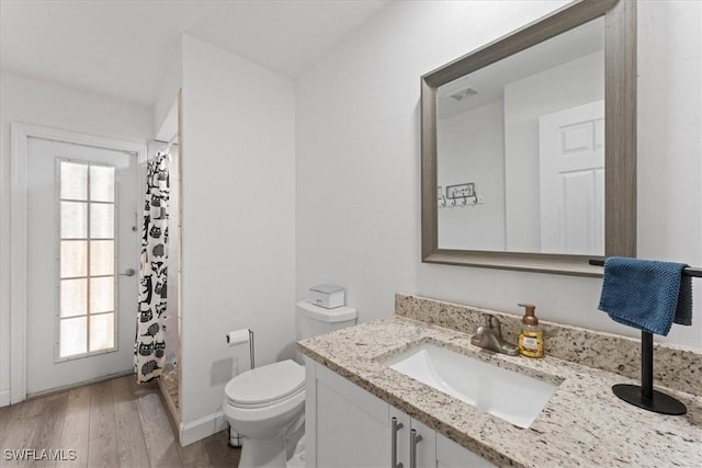 605 SW 18th Ter, Cape Coral, FL 33991 - bathroom with vanity, wood finished floors, and curtained shower