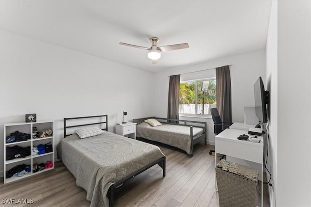 605 SW 18th Ter, Cape Coral, FL 33991 - bedroom featuring light wood-style floors and a ceiling fan