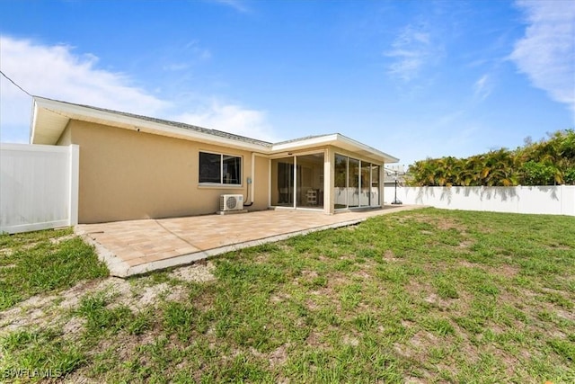 605 SW 18th Ter, Cape Coral, FL 33991 - back of property with stucco siding, a patio, and a sunroom