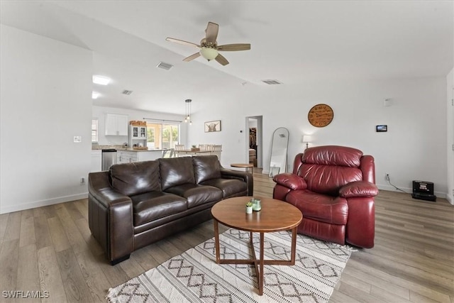 605 SW 18th Ter, Cape Coral, FL 33991 - living area featuring ceiling fan, light wood-type flooring, and vaulted ceiling