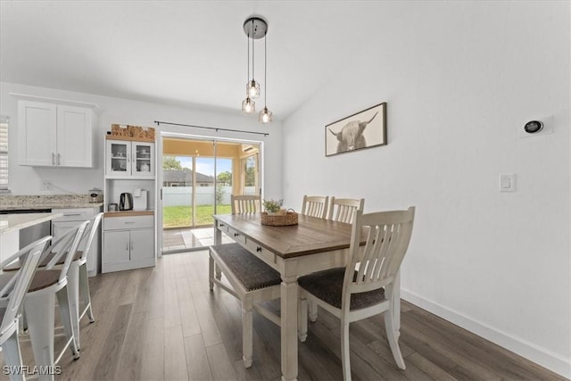 605 SW 18th Ter, Cape Coral, FL 33991 - dining room with light wood-type flooring and vaulted ceiling