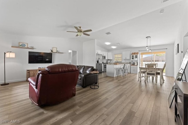 605 SW 18th Ter, Cape Coral, FL 33991 - living area featuring light wood-style floors, a ceiling fan, and lofted ceiling