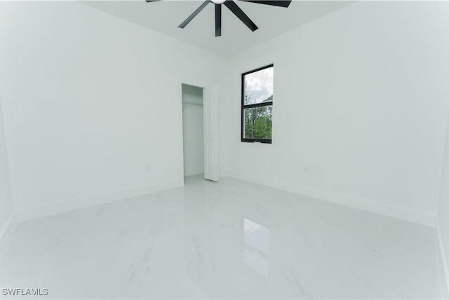 615 Greenbriar Blvd, Lehigh Acres, FL 33972 - empty room with marble finish flooring and a ceiling fan