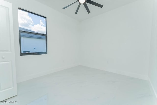 615 Greenbriar Blvd, Lehigh Acres, FL 33972 - spare room with ceiling fan and marble look tiles