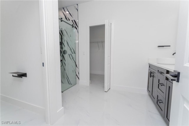 615 Greenbriar Blvd, Lehigh Acres, FL 33972 - bathroom with marble finish floors, a marble finish shower, vanity, and a walk in closet