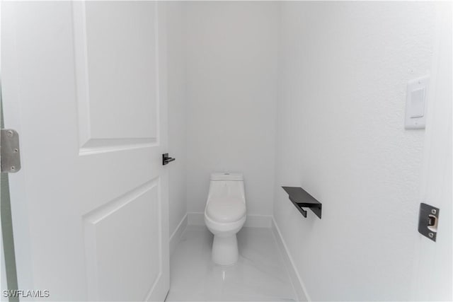 615 Greenbriar Blvd, Lehigh Acres, FL 33972 - bathroom with toilet and baseboards