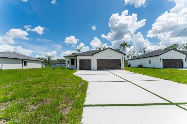 615 Greenbriar Blvd, Lehigh Acres, FL 33972 - single story home with a front yard, driveway, and an attached garage