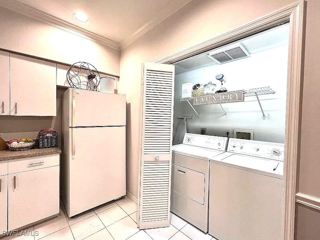 1868 Dogwood Dr, Marco Island, FL 34145 - washroom with crown molding, washer and dryer, and light tile patterned floors