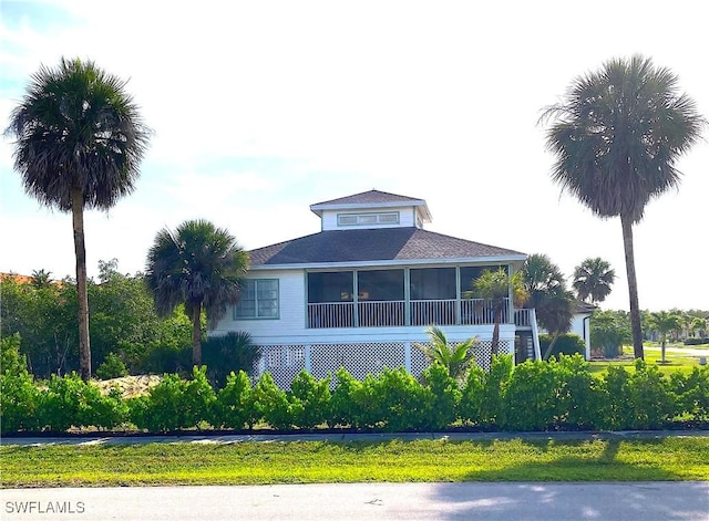 1868 Dogwood Dr, Marco Island, FL 34145 - view of side of property with a sunroom