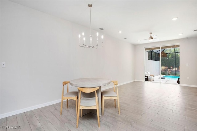 14671 Edgewater Cir, Naples, FL 34114 - dining room with light wood-style floors, a chandelier, and recessed lighting