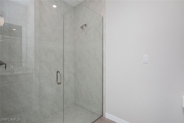 14671 Edgewater Cir, Naples, FL 34114 - full bathroom featuring tiled shower and baseboards