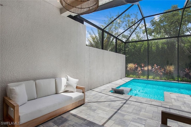 14671 Edgewater Cir, Naples, FL 34114 - swimming pool featuring a patio area, an outdoor living space, and a lanai