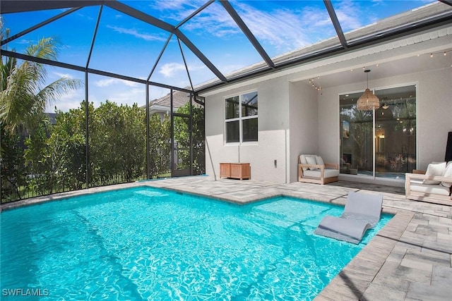 14671 Edgewater Cir, Naples, FL 34114 - outdoor pool featuring a patio area and glass enclosure