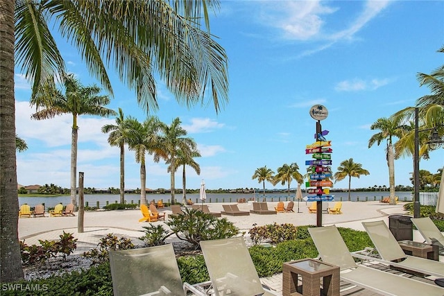 14671 Edgewater Cir, Naples, FL 34114 - view of community featuring a water view and an outdoor hangout area