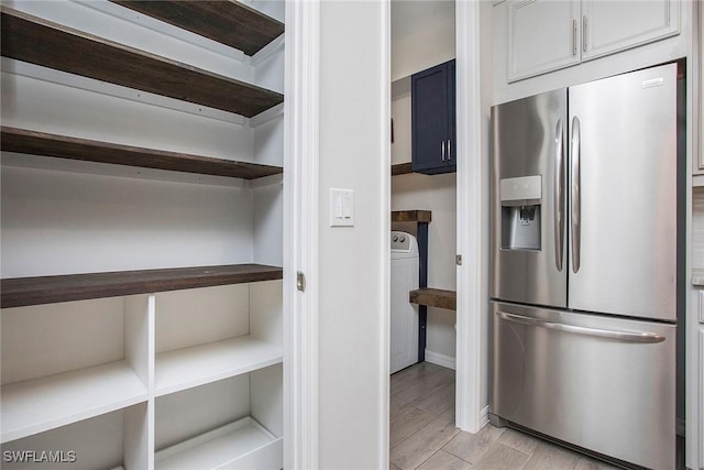 14671 Edgewater Cir, Naples, FL 34114 - storage area featuring washer / dryer