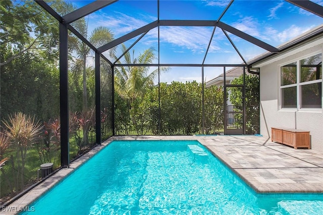 14671 Edgewater Cir, Naples, FL 34114 - outdoor pool with a patio and glass enclosure