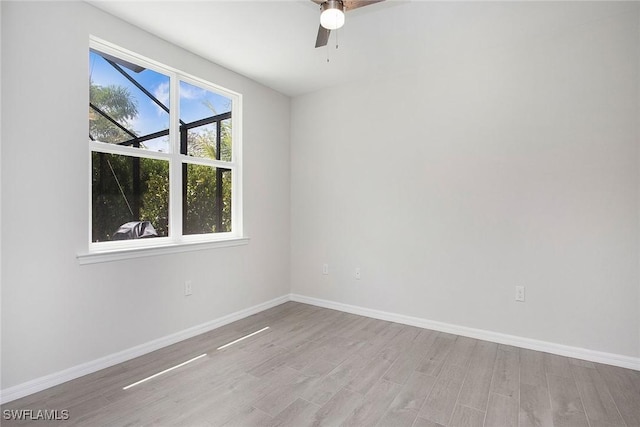 14671 Edgewater Cir, Naples, FL 34114 - spare room with wood finished floors and a ceiling fan