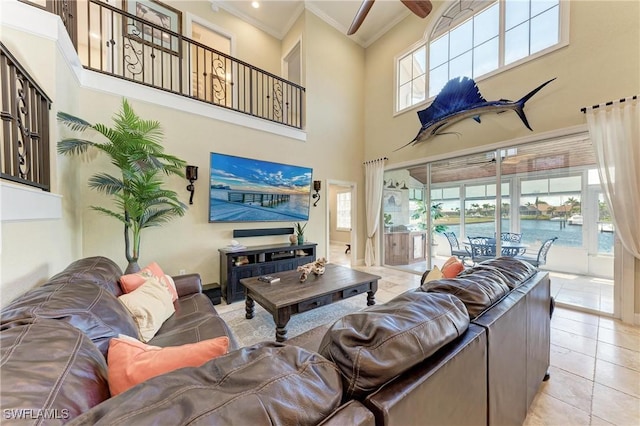 3800 Bal Harbor Blvd Unit 414, Punta Gorda, FL 33950 - living room with a ceiling fan, crown molding, a towering ceiling, and light tile patterned floors