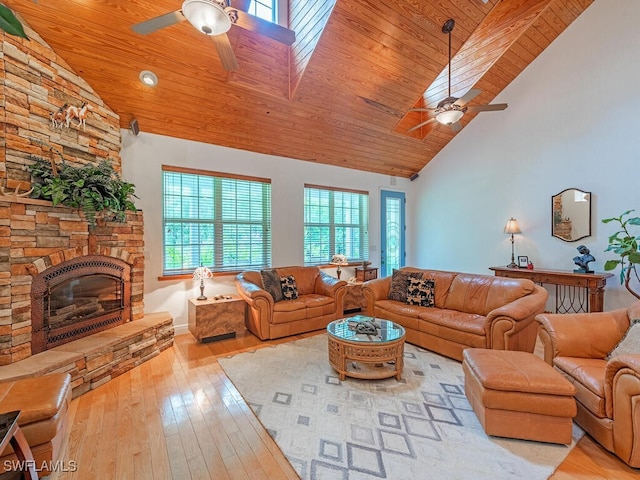 21950 N River Rd, Alva, FL 33920 - living area with a ceiling fan, hardwood / wood-style flooring, high vaulted ceiling, wooden ceiling, and a stone fireplace