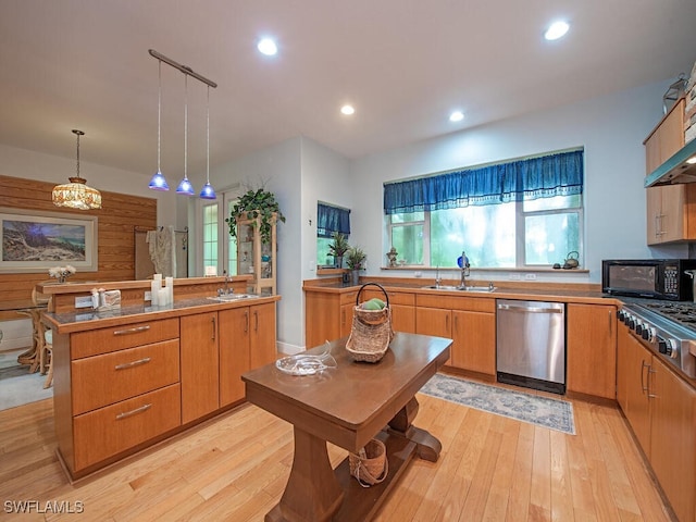 21950 N River Rd, Alva, FL 33920 - kitchen featuring stainless steel appliances, light wood-style floors, pendant lighting, recessed lighting, and a center island