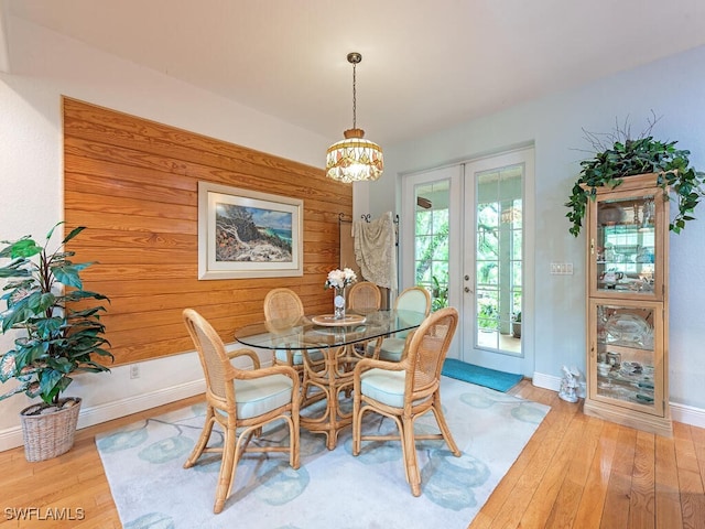 21950 N River Rd, Alva, FL 33920 - dining area featuring french doors, wood finished floors, and a chandelier