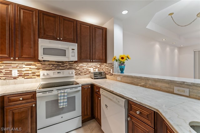 15250 Riverbend Blvd Unit 101, North Fort Myers, FL 33917 - kitchen featuring white appliances, light stone counters, decorative backsplash, light tile patterned floors, and recessed lighting