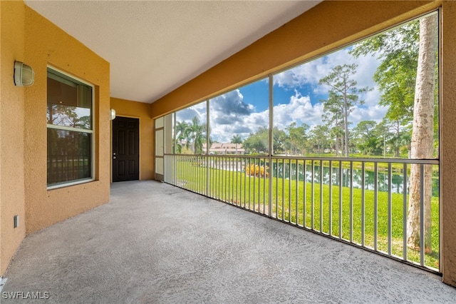 15250 Riverbend Blvd Unit 101, North Fort Myers, FL 33917 - unfurnished sunroom with a water view