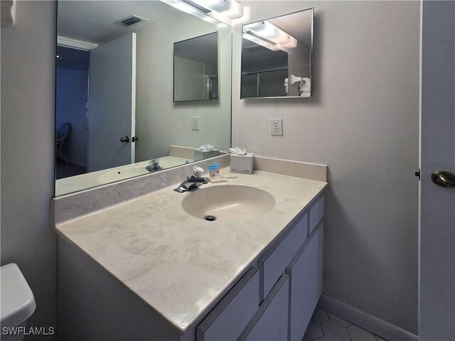 345 Mango St Unit 505, Fort Myers Beach, FL 33931 - bathroom with vanity and tile patterned floors