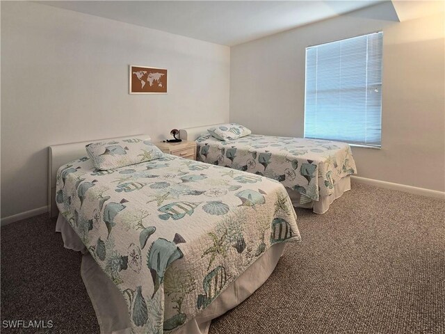 345 Mango St Unit 505, Fort Myers Beach, FL 33931 - carpeted bedroom featuring baseboards