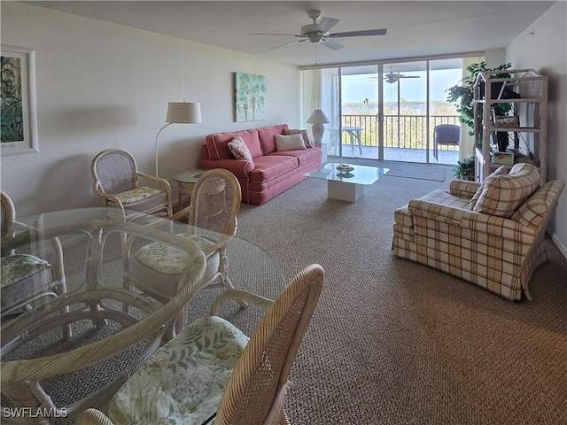 345 Mango St Unit 505, Fort Myers Beach, FL 33931 - living room with ceiling fan, carpet flooring, and expansive windows