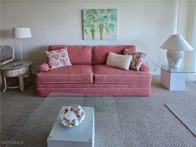 345 Mango St Unit 505, Fort Myers Beach, FL 33931 - carpeted living room with baseboards