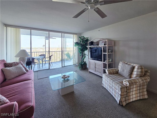 345 Mango St Unit 505, Fort Myers Beach, FL 33931 - living area with ceiling fan, carpet flooring, and a wall of windows