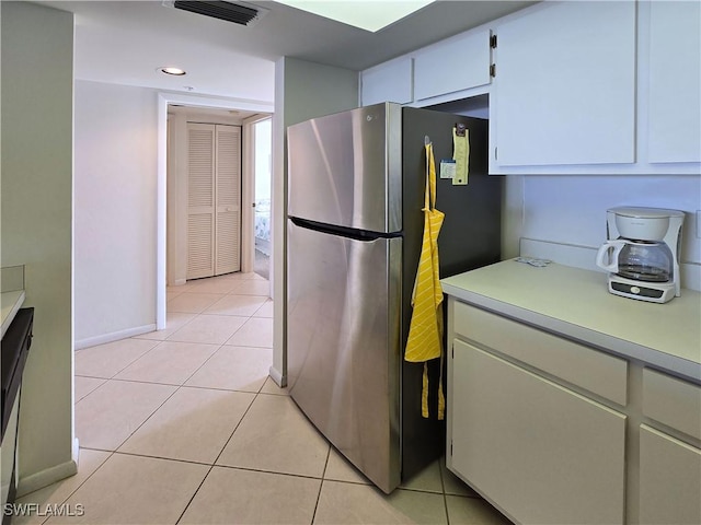 345 Mango St Unit 505, Fort Myers Beach, FL 33931 - kitchen featuring freestanding refrigerator, light countertops, light tile patterned flooring, and recessed lighting