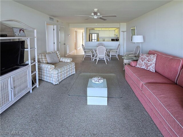 345 Mango St Unit 505, Fort Myers Beach, FL 33931 - carpeted living area with ceiling fan