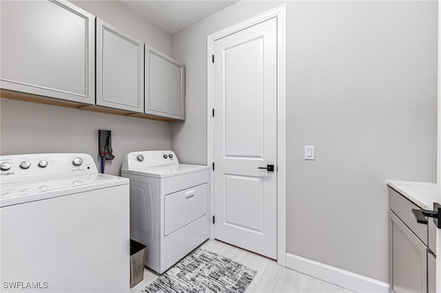 19604 Beechcrest Pl, Estero, FL 33928 - laundry room with washing machine and clothes dryer and cabinet space