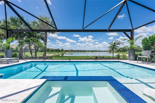 19604 Beechcrest Pl, Estero, FL 33928 - view of pool featuring a pool with connected hot tub, a water view, glass enclosure, and a patio