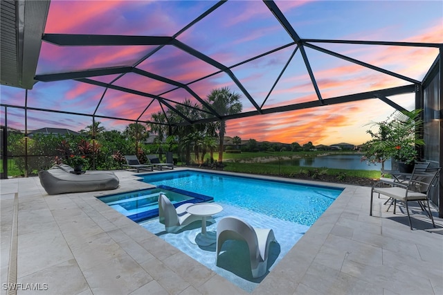 19604 Beechcrest Pl, Estero, FL 33928 - pool at dusk with a water view, a patio, a pool with connected hot tub, and a lanai