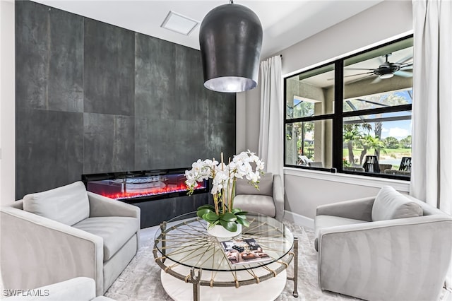 19604 Beechcrest Pl, Estero, FL 33928 - living area with a glass covered fireplace and a ceiling fan