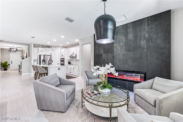 19604 Beechcrest Pl, Estero, FL 33928 - living room featuring recessed lighting and a chandelier