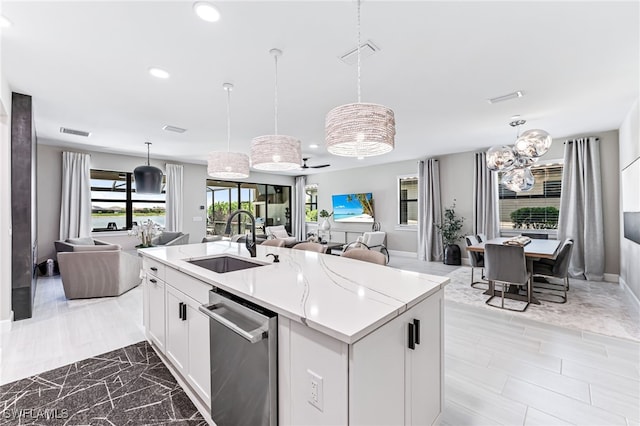 19604 Beechcrest Pl, Estero, FL 33928 - kitchen featuring stainless steel dishwasher, open floor plan, recessed lighting, decorative light fixtures, and white cabinets