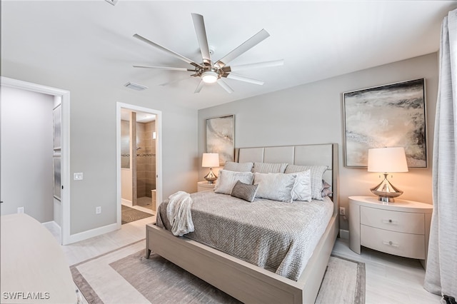 19604 Beechcrest Pl, Estero, FL 33928 - bedroom with connected bathroom and a ceiling fan