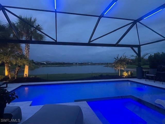 19604 Beechcrest Pl, Estero, FL 33928 - view of swimming pool featuring a water view, a lanai, a patio area, and a pool with connected hot tub