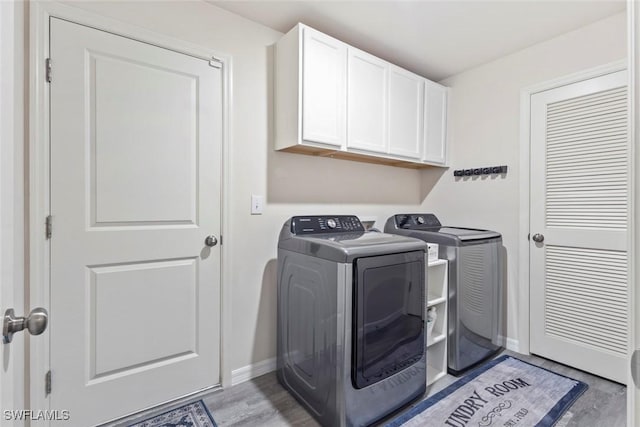 9059 Aegean Cir, Lehigh Acres, FL 33936 - laundry room featuring cabinet space and washer and dryer